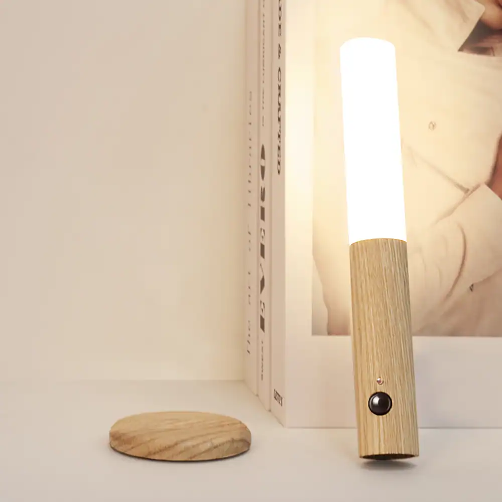 A stylish wooden table lamp with soft white light, perfect for bedroom or living room lighting, featuring minimalist design and natural wood finish for a cozy ambiance.