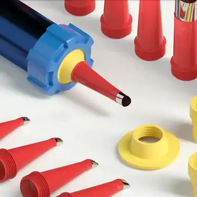 Brightly colored vape pen cartridges and caps in red, yellow, and blue, designed for use with electronic cigarettes and vaping devices, displayed on a clean white surface.