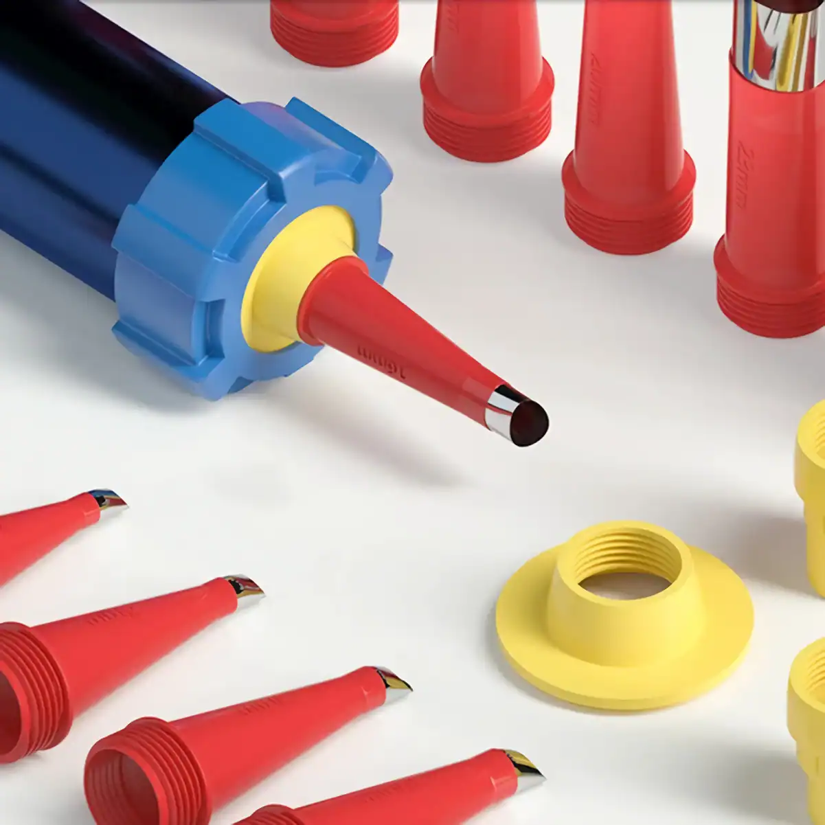 Brightly colored vape pen cartridges and caps in red, yellow, and blue, designed for use with electronic cigarettes and vaping devices, displayed on a clean white surface.