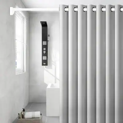 Elegant bathroom shower with white curtains, black shower panel, and minimalist decor, creating a clean and contemporary look for home or spa settings.