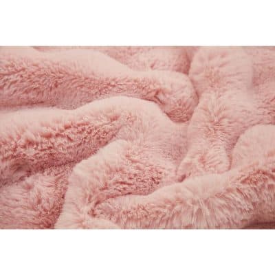 Close-up image of a soft, pink plush fabric, showcasing its fuzzy and fluffy texture, ideal for blankets, throws, and cozy accessories at Monalisa Store.