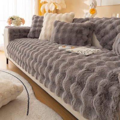 Highly Comfortable Soft Faux Fur Couch Cover in Elegant Gray and Cream Colors for Stylish Living Room Decor.