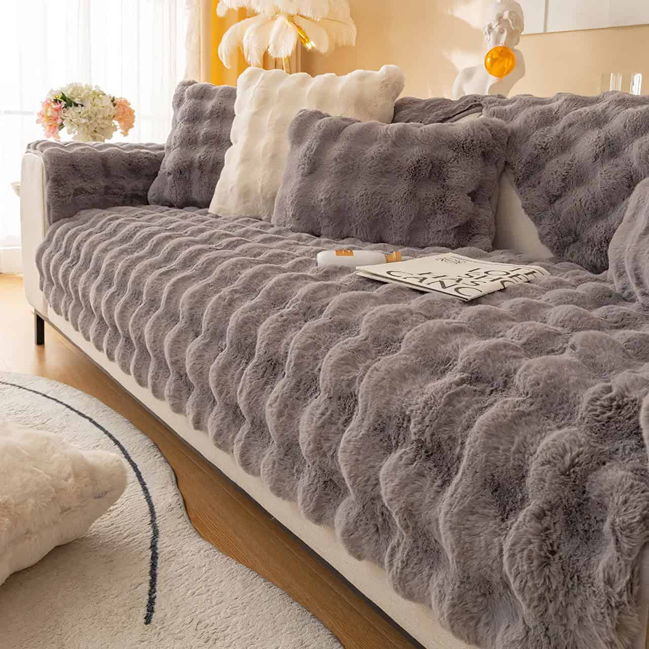 Highly Comfortable Soft Faux Fur Couch Cover in Elegant Gray and Cream Colors for Stylish Living Room Decor.