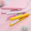 Colorful hair straighteners in pink, white, and yellow for hairstyling and hair care, ideal for home or professional salon use.