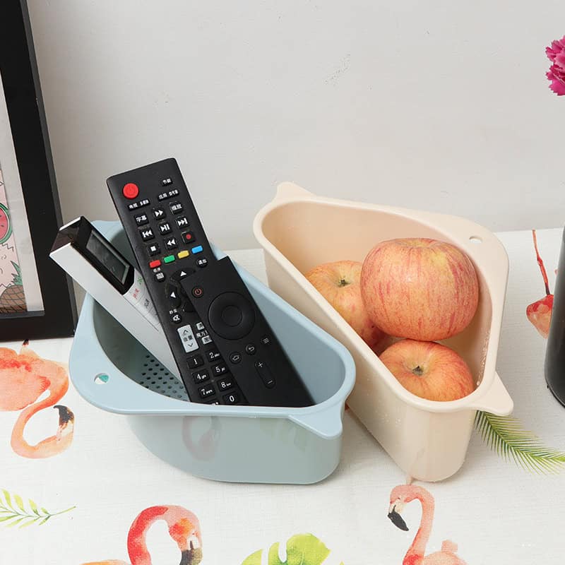 Compact storage bins for remote controls and apples, perfect for organizing optical store essentials and daily items.