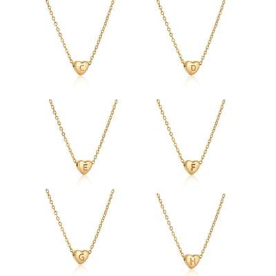 Delicate gold heart necklaces with engraved initials, perfect for personalized jewelry or gift-giving. Elegant design suitable for everyday wear or special occasions.