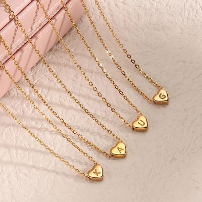 Gold heart pendant nameplate necklaces with personalized initials, trendy jewelry perfect for gifting or everyday wear, luxurious and stylish accessories at Monalisa Store.