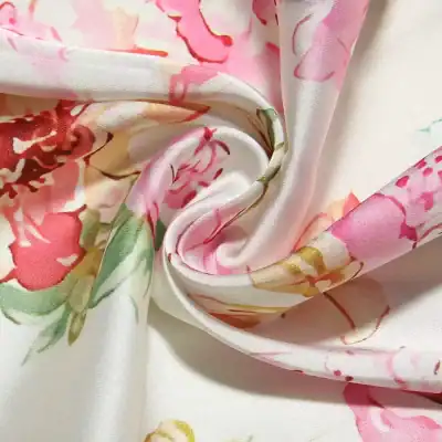 Luxurious pink, white, and green floral silk fabric, perfect for high-end fashion, dresses, and accessories. Soft, smooth, and lightweight material ideal for stylish, comfortable garments.