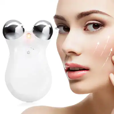 Close-up of a woman using a high-tech facial massage device with dual rotating heads for skincare and facial rejuvenation, emphasizing advanced beauty technology and skin care treatments.