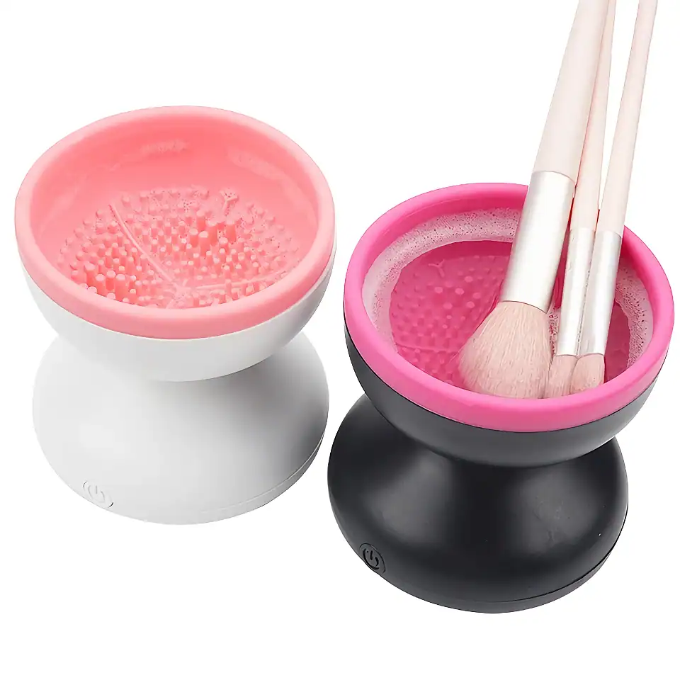 LED nail dryer cups with pink and black design, ideal for quick and efficient drying of gel and nail polish, with soft touch base and included brushes for flawless manicure procedures.