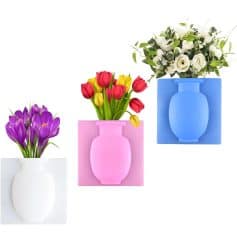 Bright flower arrangements in stylish pastel-colored vases, perfect for decorating an optometry clinic, optical shop, or eye care center to create a welcoming atmosphere.