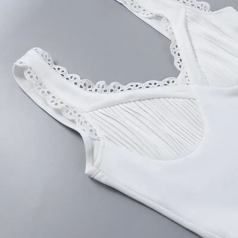 White lace-trimmed sleeveless top with intricate detailing for stylish everyday wear. Perfect for casual or dressy occasions, combining comfort and elegance seamlessly.