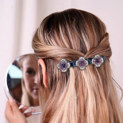A glamorous crystal hair clip adds elegance to hairstyles, ideal for special occasions or daily wear.
