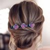Colorful hair clip with purple, pink, and white rhinestones, perfect for elegant hairstyles, available at Monalisa Medical Store.