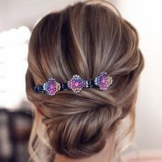 Colorful hair clip with purple, pink, and white rhinestones, perfect for elegant hairstyles, available at Monalisa Medical Store.