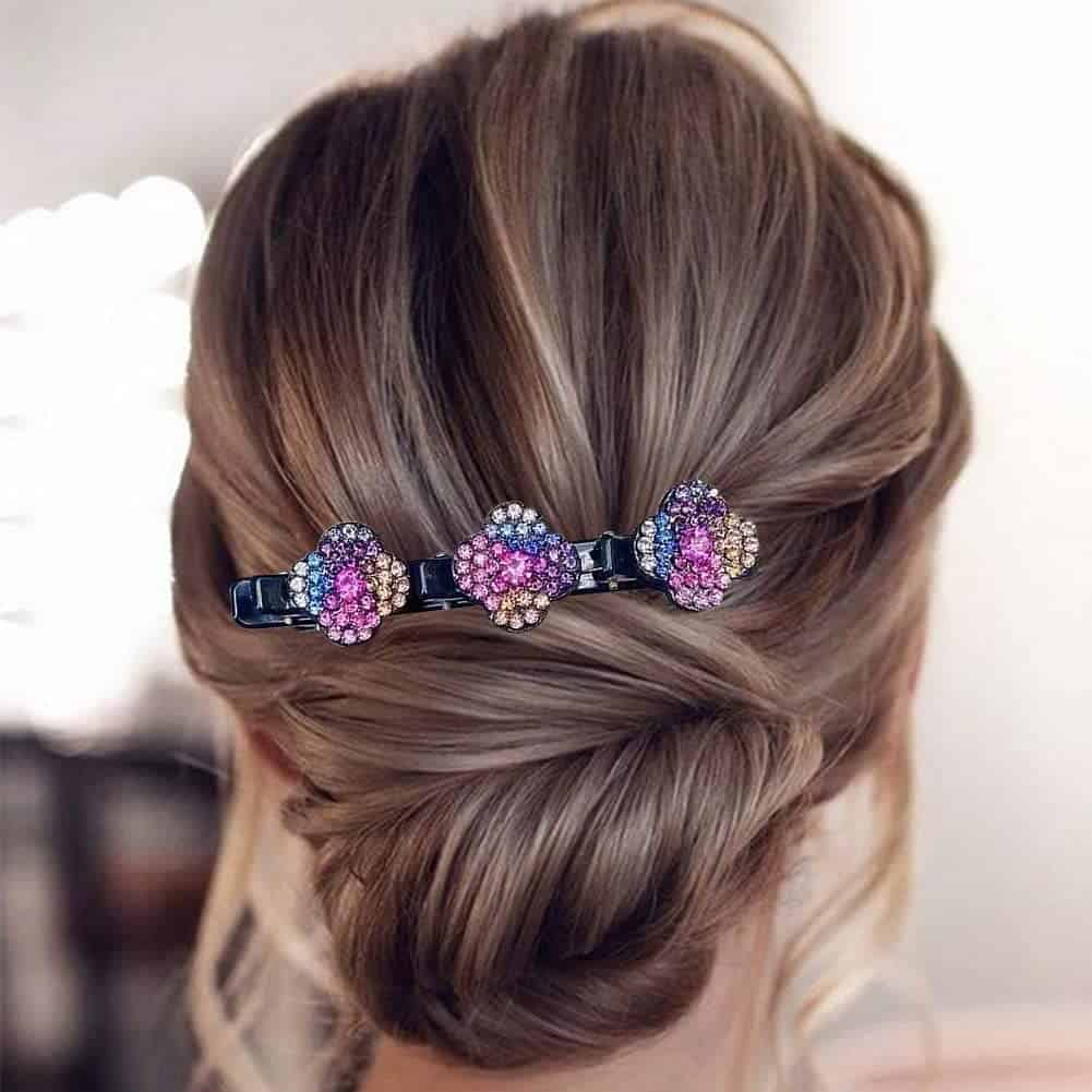 Colorful hair clip with purple, pink, and white rhinestones, perfect for elegant hairstyles, available at Monalisa Medical Store.
