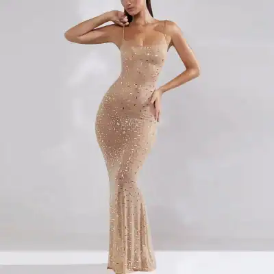 Stunning gold sequin gown featuring a fitted silhouette, spaghetti straps, and a mermaid hem, perfect for special occasions and events. Rayon fabric enhances the glamorous and luxurious look.
