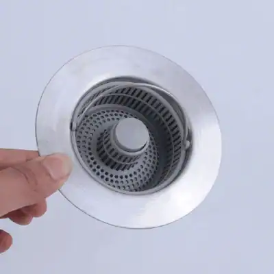 A close-up of a sleek, stainless steel shower drain cover designed for bathroom drainage systems, offering durability and style for a clean, functional shower space.