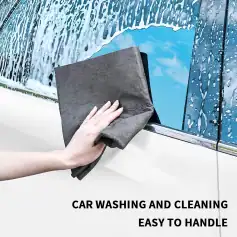 High-quality cloth cleaning car windows, effective for removing dirt and water spots, ensuring clear visibility and a sparkling look for your vehicle. Perfect for quick, easy car wash maintenance.