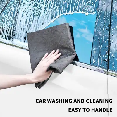 High-quality cloth cleaning car windows, effective for removing dirt and water spots, ensuring clear visibility and a sparkling look for your vehicle. Perfect for quick, easy car wash maintenance.