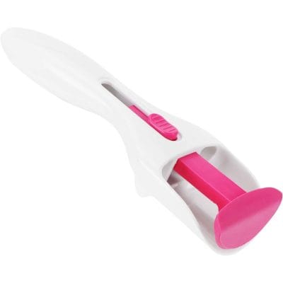 A white and pink eyelash curler with a safety mechanism for perfect eye lash curling, ideal for enhancing the look of your eyelashes with precision and comfort.