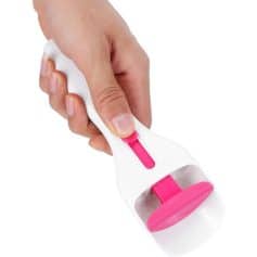 Hand holding optical cleaning device with pink rubber pad for eyeglasses and lenses.