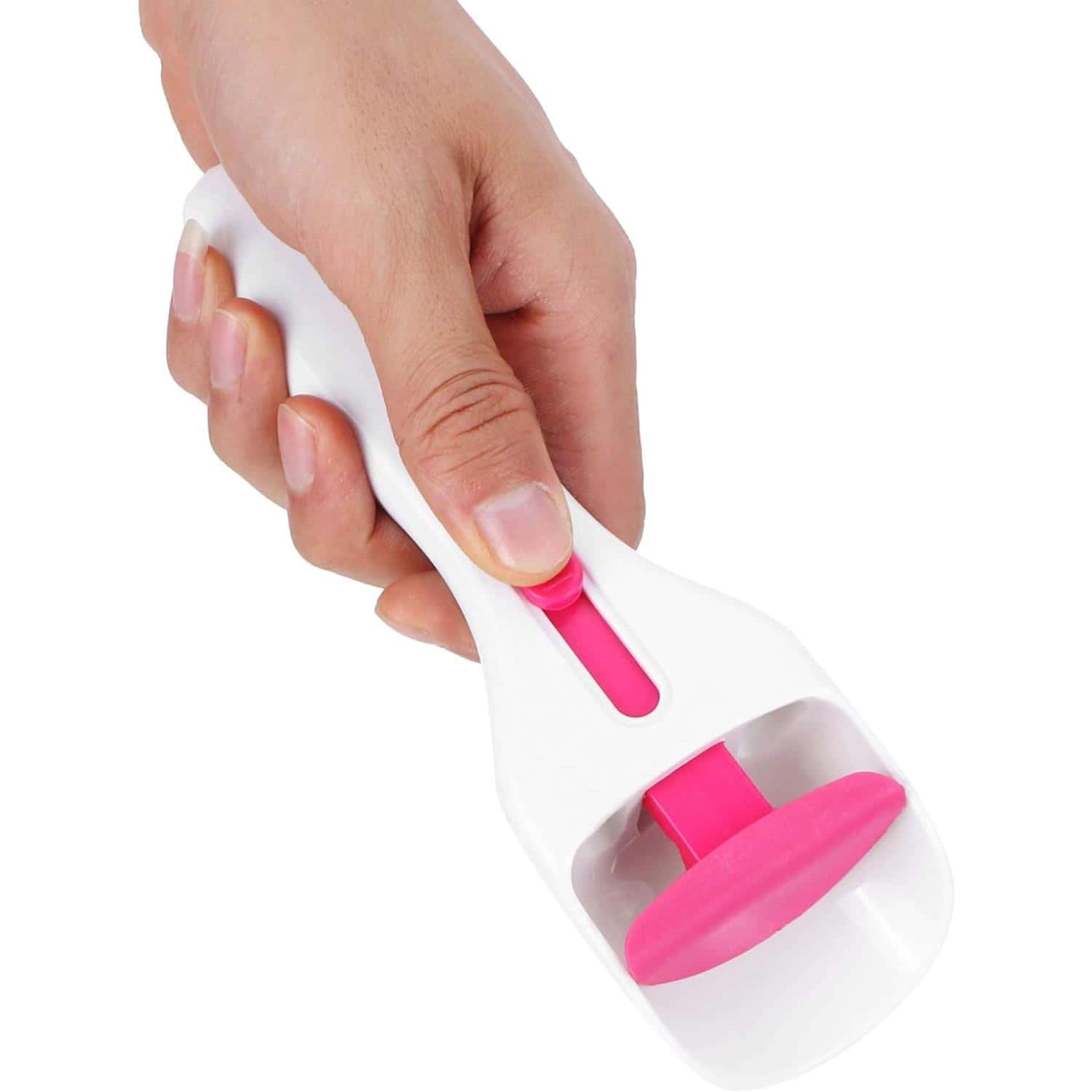 Hand holding optical cleaning device with pink rubber pad for eyeglasses and lenses.