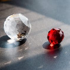 Luxurious crystal gems ideal for glasses and jewelry, featuring crystal-clear and vibrant red stones for designer eye accessories at Monalisa Medical.