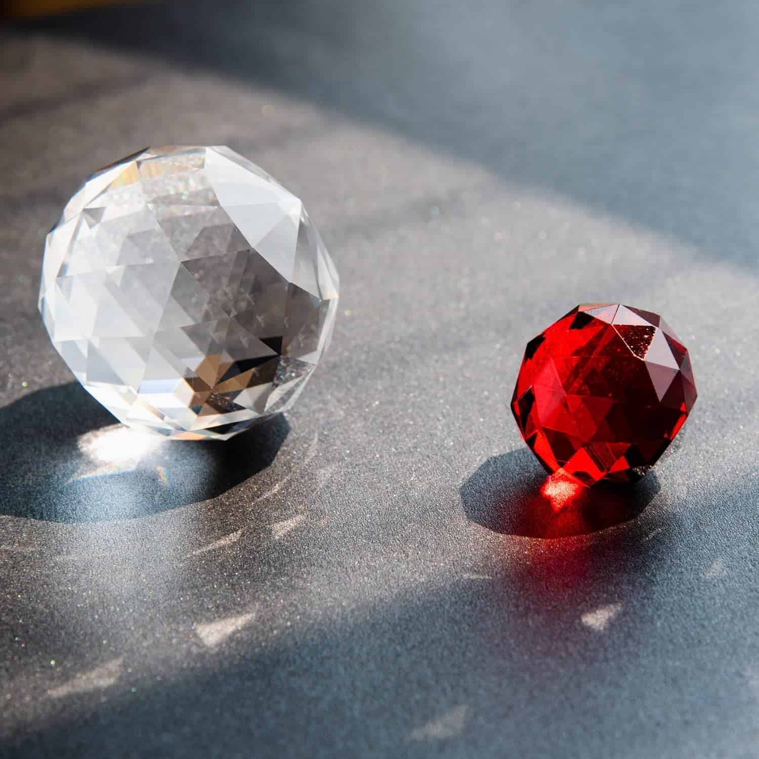 Luxurious crystal gems ideal for glasses and jewelry, featuring crystal-clear and vibrant red stones for designer eye accessories at Monalisa Medical.