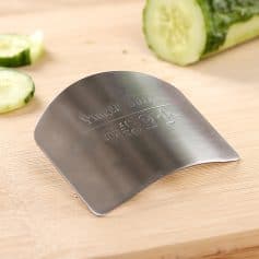 Stainless steel cucumber slicing knife with ergonomic handle for precise cuttings.