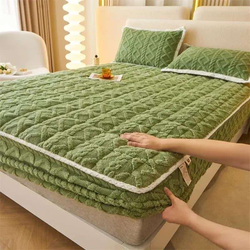 Soft green mattress with quilted design, perfect for a restful sleep, featured at Monalisa Medical Store. Unique shape for added comfort and style.