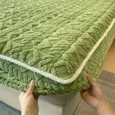 Comfortable, cozy, and eco-friendly green plush mattress protector ideal for enhancing sleep quality and protecting mattresses from spills and allergens.
