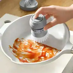 High-quality steam cleaner used to remove food residue from frying pan.