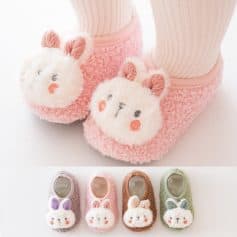 Soft, plush bunny slippers with adorable animal face design, available in multiple pastel colors perfect for women and children, offering warmth and comfort for indoor wear.