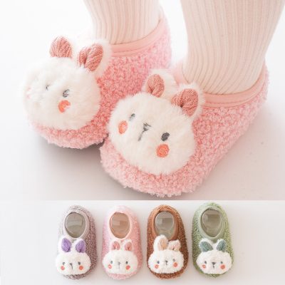 Soft, plush bunny slippers with adorable animal face design, available in multiple pastel colors perfect for women and children, offering warmth and comfort for indoor wear.