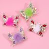 Bright colorful butterfly hair accessories with pearls and faux fur for kids and women, perfect for hair styling and fashion.