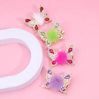 Colorful butterfly hair clips with feather accents, rhinestones, and elegant design for women's hair accessories. Perfect for adding a touch of glamour and playful charm to any hairstyle.