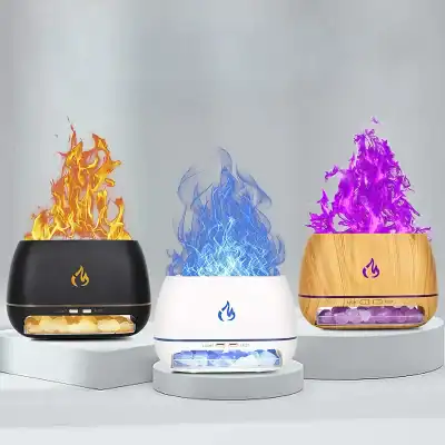 A visually appealing set of three aroma diffusers with colorful flame effects, available in black, white, and wood finish, perfect for enhancing your space with soothing scents and ambient lighting.