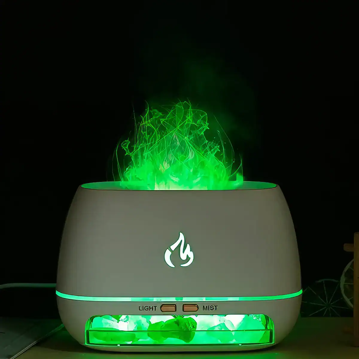 Ultrasonic diffuser emitting green mist with internal lighting, designed for essential oils and air purification, ideal for wellness and spa environments.