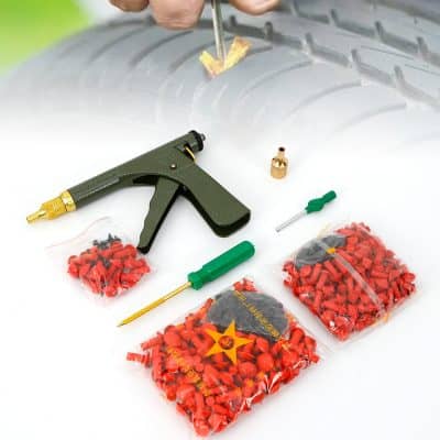A tire repair kit with a tire pluggun, rubber plugs, screwdrivers, and accessories for quick and easy tubeless tire puncture repairs. Ideal for automotive tire maintenance and emergency fixes.