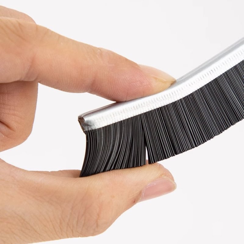 Close-up of a hand holding a false eyelash applicator tool with synthetic lashes, used for easy eyelash extension and eyelash application at the Monalisa Store.