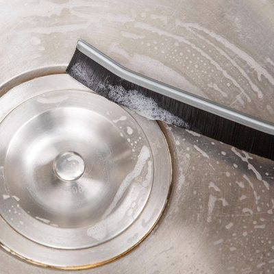 Optical cleaning tools and bathroom hygiene supplies for a sparkling sink.