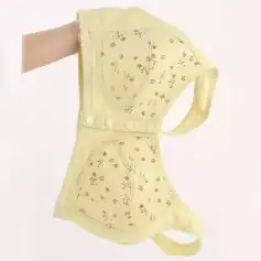 Light yellow protective face mask with floral embroidery, breathable material, and adjustable straps for comfortable wear; ideal for healthcare professionals and everyday use.