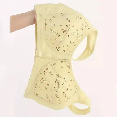 Light yellow protective face mask with floral embroidery, breathable material, and adjustable straps for comfortable wear; ideal for healthcare professionals and everyday use.