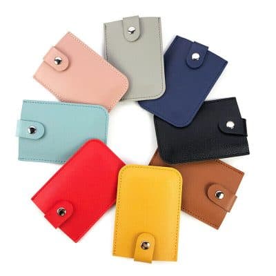 Vibrant collection of leather wallets including pink, gray, navy, black, light blue, red, yellow, and brown, perfect for stylish storage and everyday use.