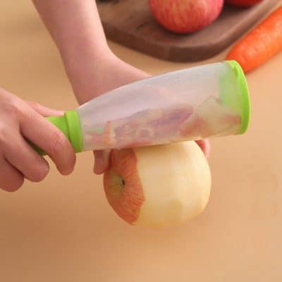 Healthy apple slices prepared using a kitchen slicer, ideal for snacks or recipes.