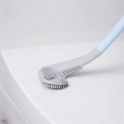 Dental cleaning brush with silicone bristles for effective plaque removal.