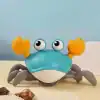 Playful crab-shaped robot toy with large googly eyes and orange claws, designed for children's entertainment and educational purposes.