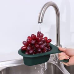 High-quality red grapes in a water basin, showcased at Monalisa Medical Store for health and wellness purposes, emphasizing fresh produce and natural supplements.