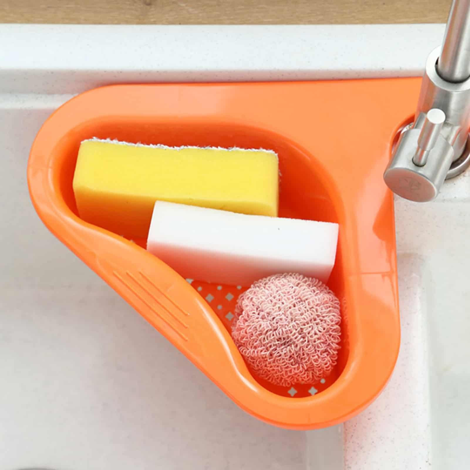 Alt text: Image of cleaning sponges and a mesh scrubber in an orange sink, suitable for optical stores or eyewear cleaning stations.